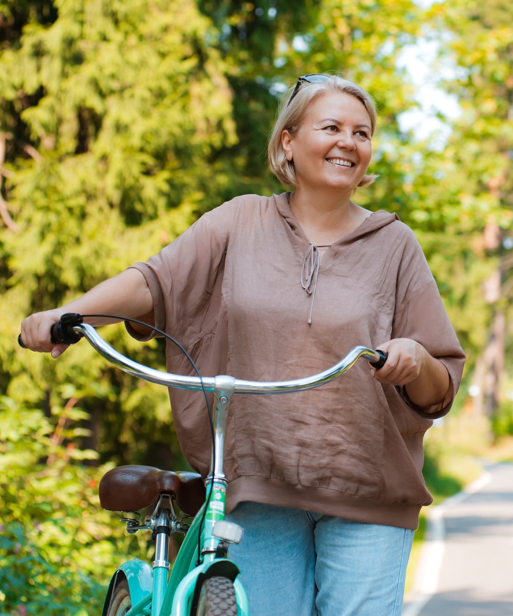 a person holding a bicycle